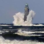 Rough sea pounded Minot Light at the entrance of Scituate and Cohasset harbors.